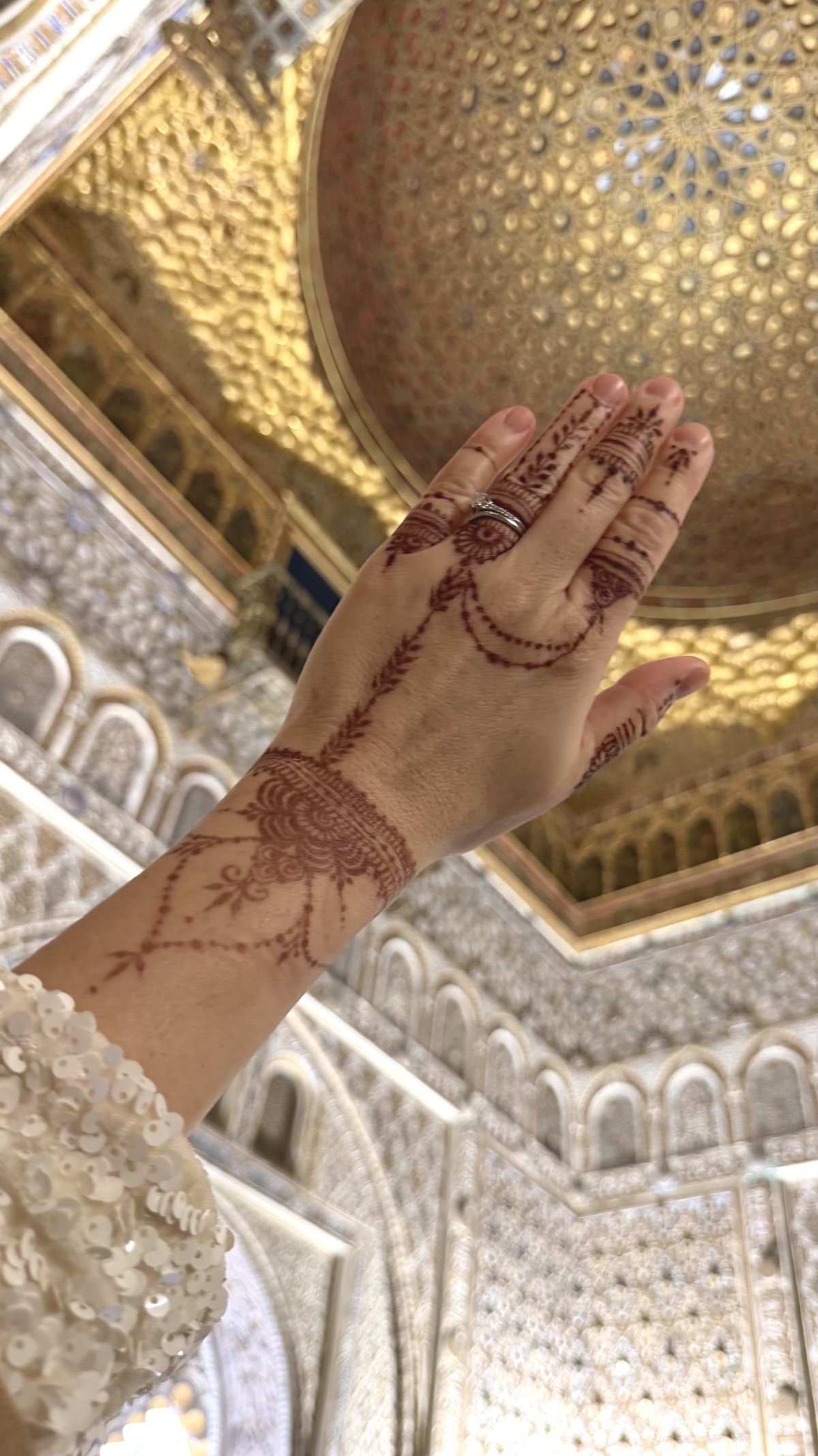 Bridal and photoshoot henna artist in Geneva Bridal henna on ornate background of Alhambra